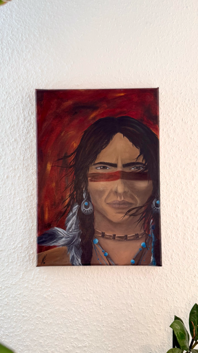 Porträt eines indigenen Menschen mit dunklen Haaren und traditioneller Kleidung.