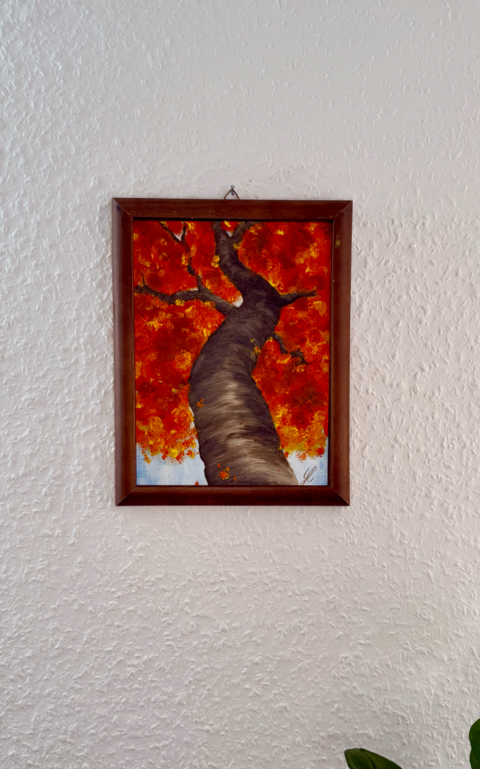 Ein Gemälde eines baumartigen Stamm mit leuchtend roten Blättern im Hintergrund.
